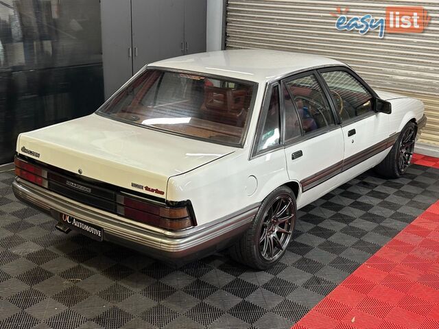 1986 HOLDEN COMMODORE SL VL 4D SEDAN