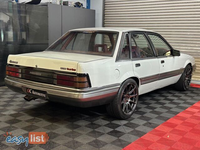 1986 HOLDEN COMMODORE SL VL 4D SEDAN