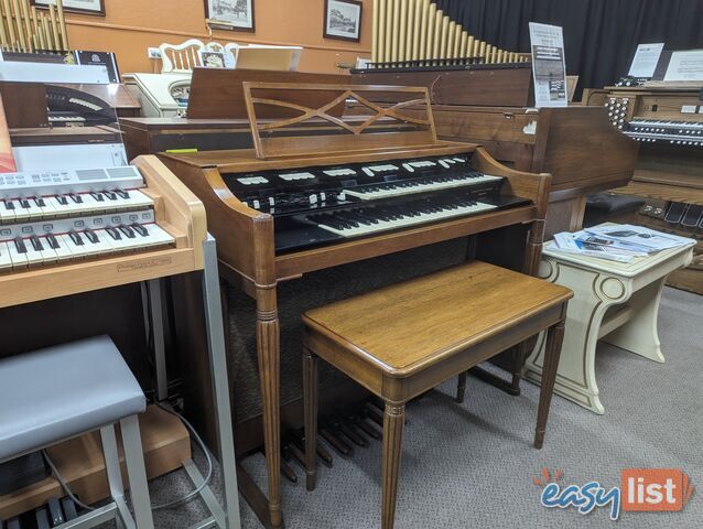 Hammond M100 Series Tone Wheel Organ - M-111, tradition style in walnut.